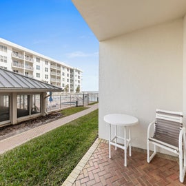 Patio with clubhouse and pool views